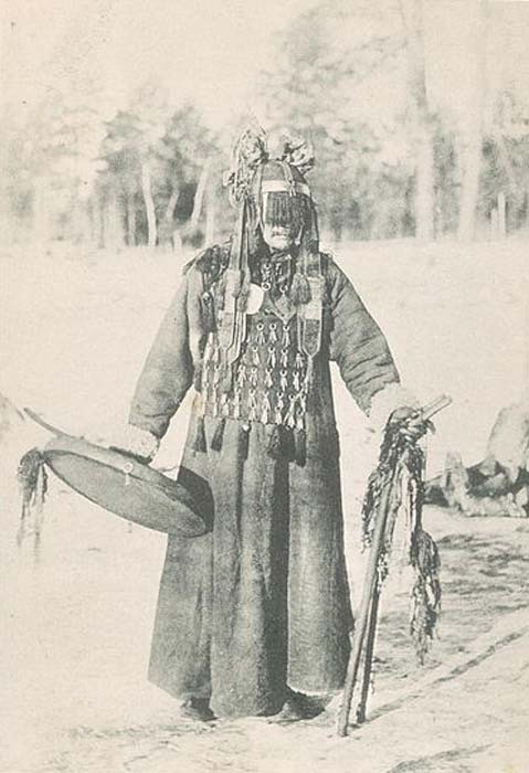 A Buryat shaman with drum, photographed in the Russian Empire.